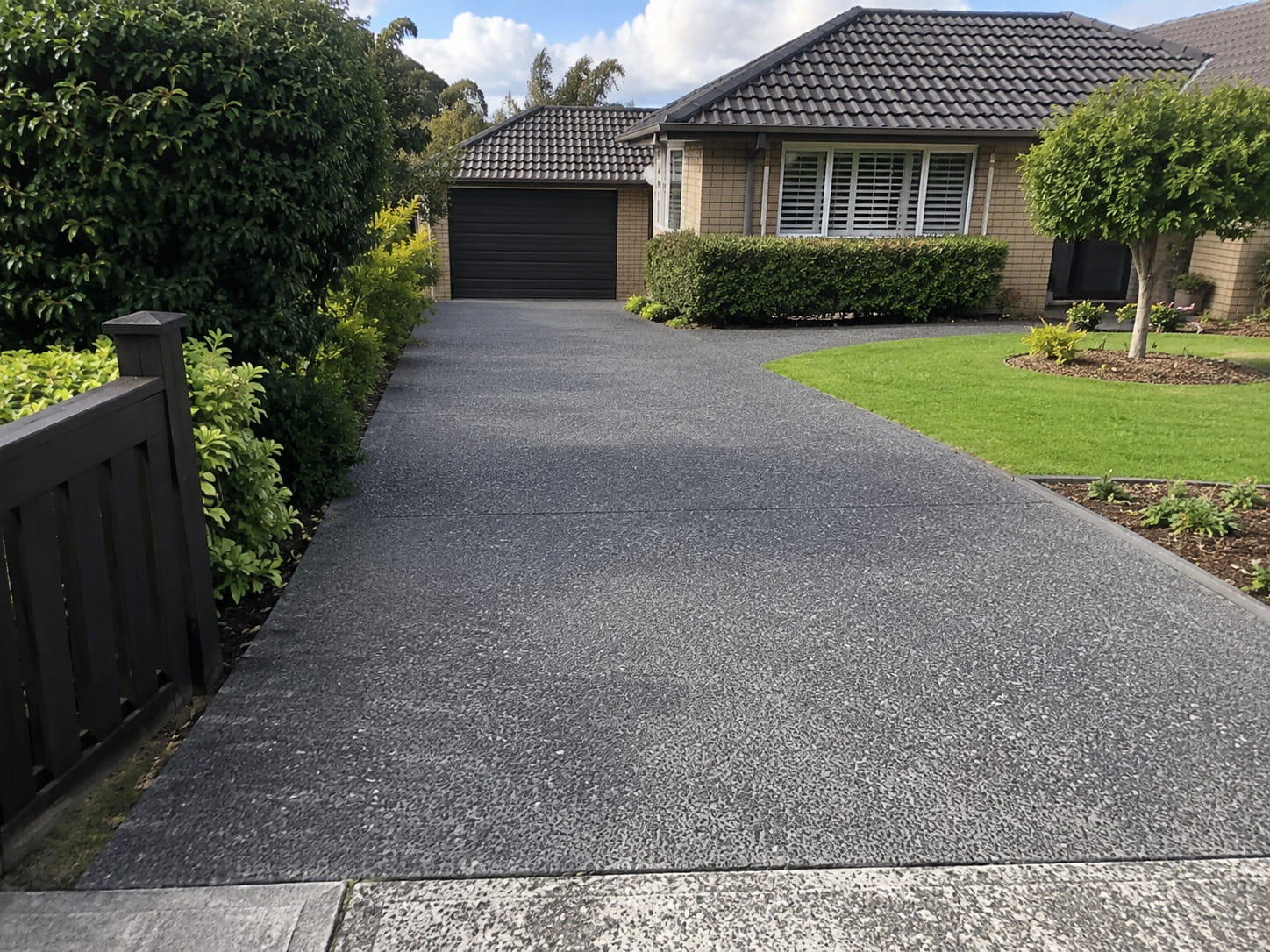 Charcoal exposed aggregate driveway Auckland