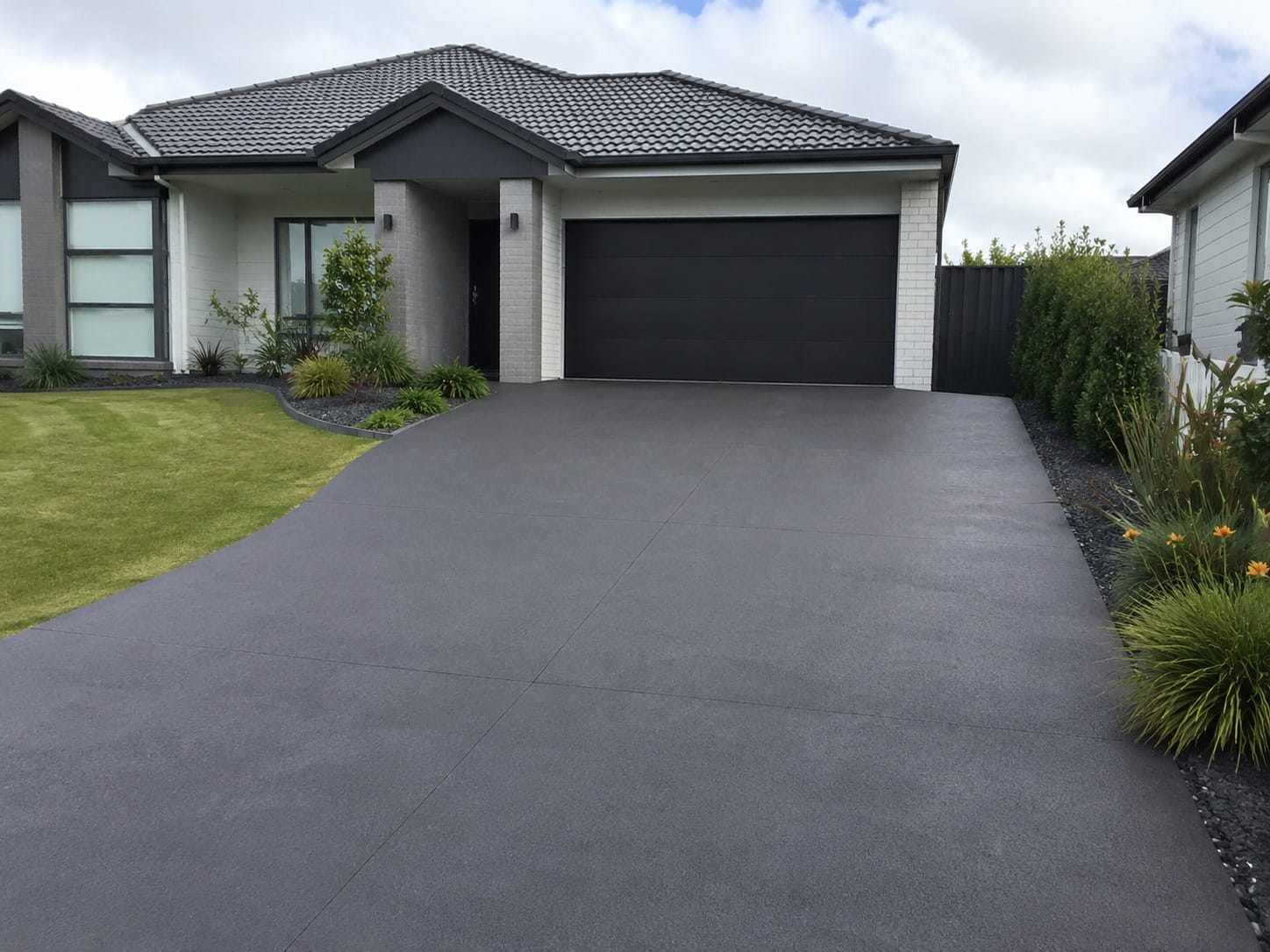 Coloured concrete driveway Auckland