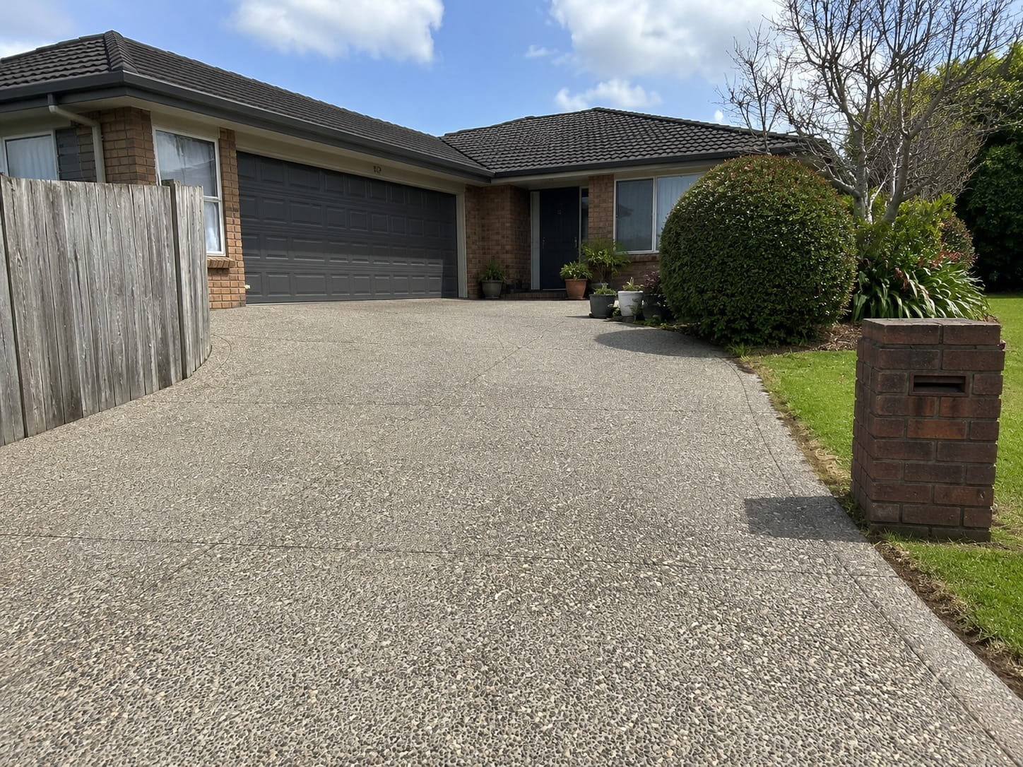 River pebble aggregate concrete driveway Auckland